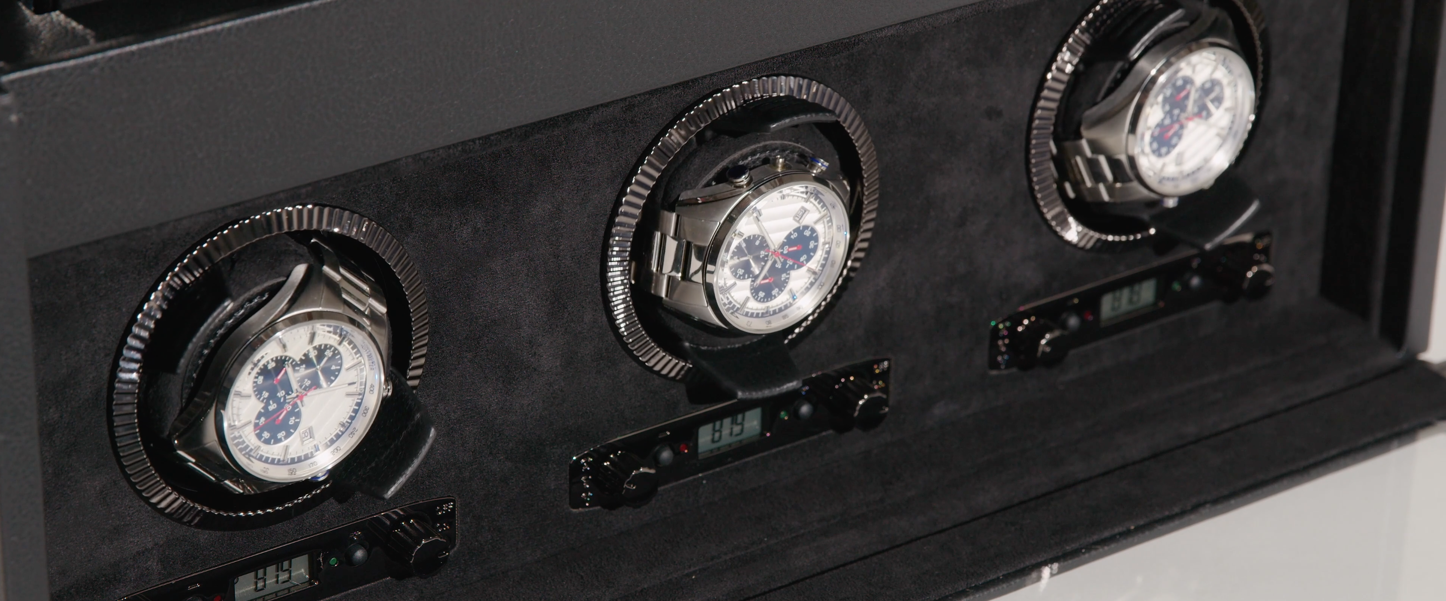 Close-up picture of 3 watches on a WOLF1834 watch winder available at Deutsch Fine Jewelry in Houston, Texas