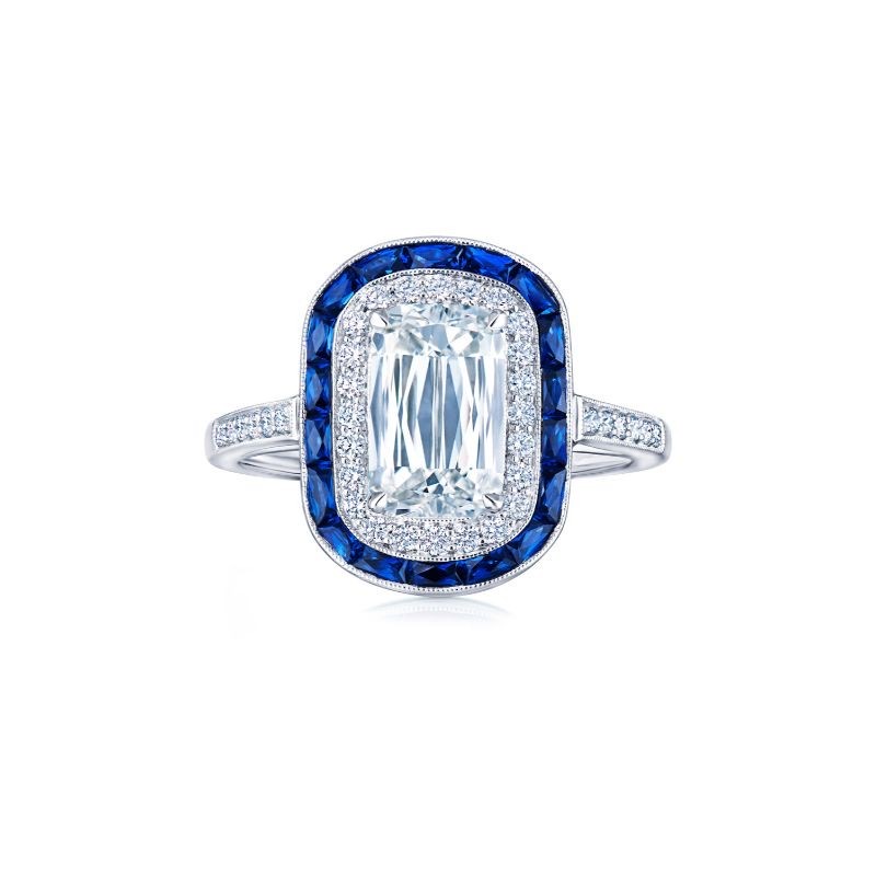 A Gorgeous Kwiat Ashoka Diamond with Double Diamond and Sapphire Halos, available at Deutsch Fine Jewelry in Houston, Texas