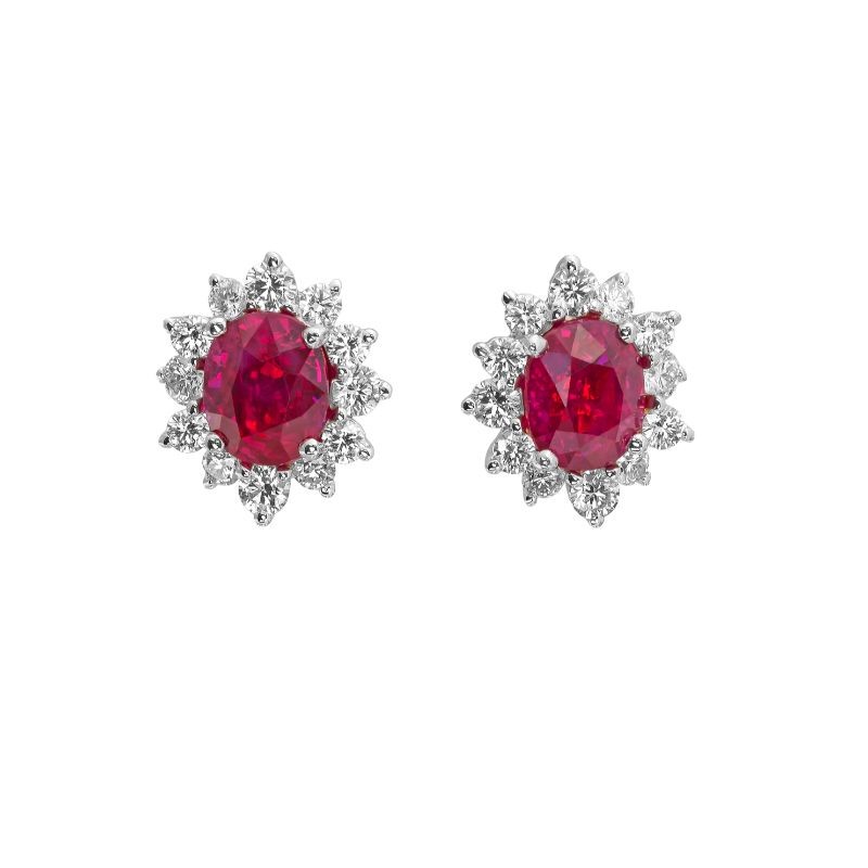 Stunning Sun-shaped Oval Ruby and Diamond Halo Earrings by Jye’s International, available at Deutsch Fine Jewelry in Houston, Texas.