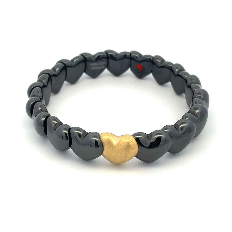 Chic Stretch Black Ceramic Heart Bracelet with 1 Matte Yellow Gold Heart by Robert Demeglio, available at Deutsch Fine Jewelry in Houston, Texas.