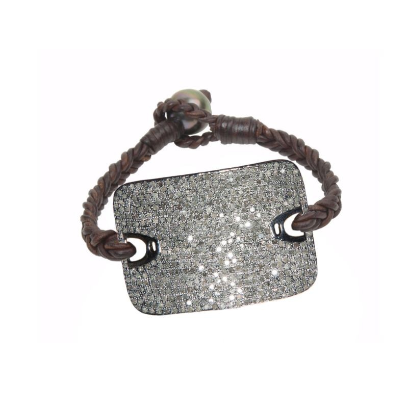 Rustic braided leather bracelet with a large silver plate covered in diamonds and a Tahitian pearl clasp by Vincent Peach, available at Deutsch Fine Jewelry in Houston, Texas.