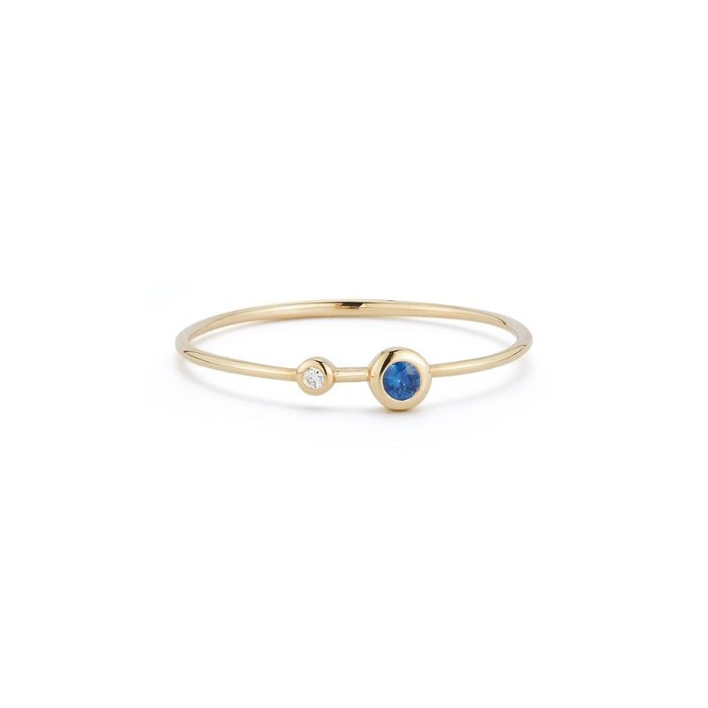 Dainty September birthstone Deutsch Signature Two Bezel Diamond and Blue Sapphire Thin Band, available at Deutsch Fine Jewelry in Houston, Texas.