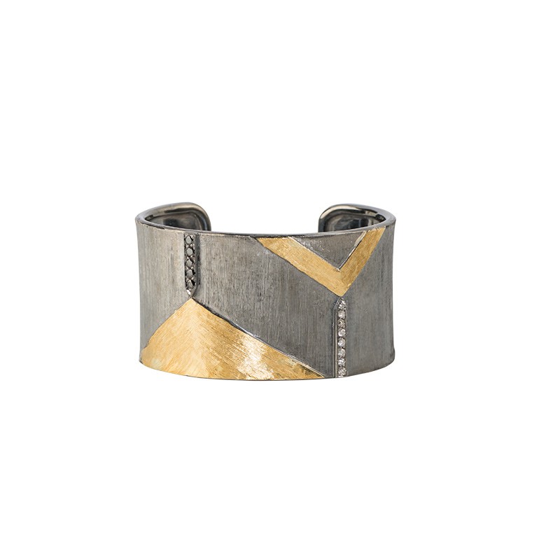 Thick silver and yellow gold John Apel Black and White Diamond Wide Cuff Bracelet, available at Deutsch Fine Jewelry in Houston, Texas.