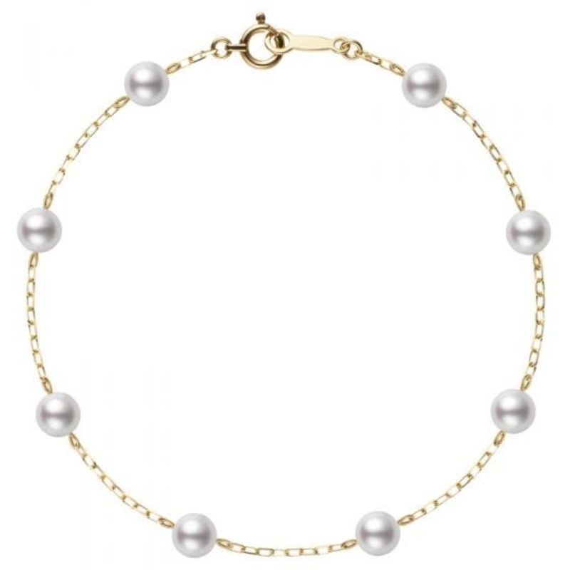 Demure Yellow Gold Pearl Station Chain Bracelet by Mikimoto, available at Deutsch Fine Jewelry in Houston, Texas.