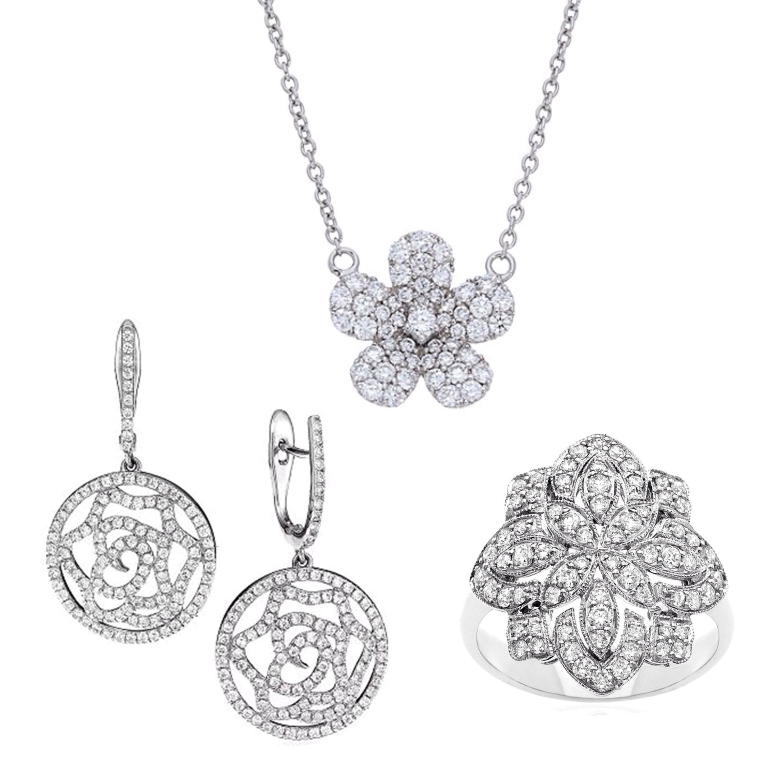 Photo of the Pave Diamond Flower Necklace in white gold, Diamond Antique Ring in white gold, and Open Pave Diamond Flower Drop Huggie Earrings in white gold, all available at Deutsch Fine Jewelry in Houston, Texas.