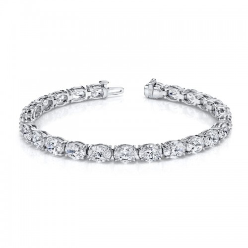 Norman Silverman Oval-Cut Diamonds Set In An East-West Platinum 4-Prong Bracelet.